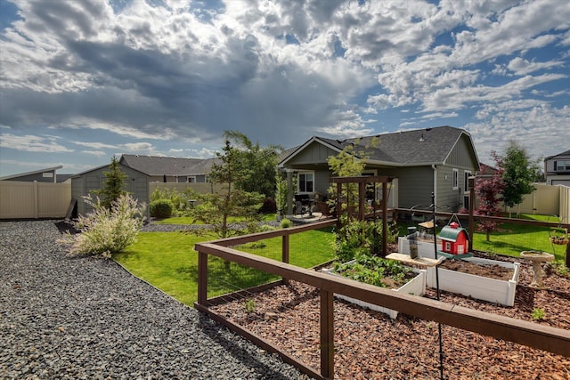 8202 W Quaking Rd, Spokane, WA 99224 - rear view of property with a garden