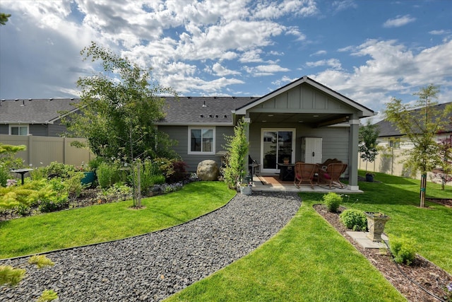8202 W Quaking Rd, Spokane, WA 99224 - back of property with a patio and board and batten siding