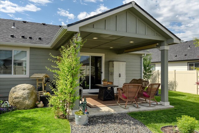 8202 W Quaking Rd, Spokane, WA 99224 - back of house featuring board and batten siding, a patio, and a shingled roof