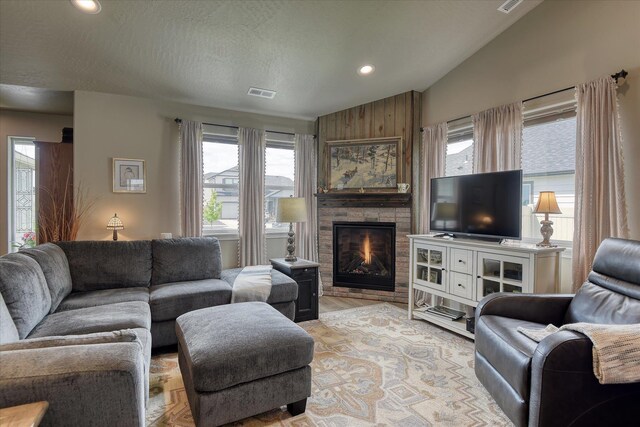 8202 W Quaking Rd, Spokane, WA 99224 - living room with a fireplace, healthy amount of natural light, lofted ceiling, and recessed lighting