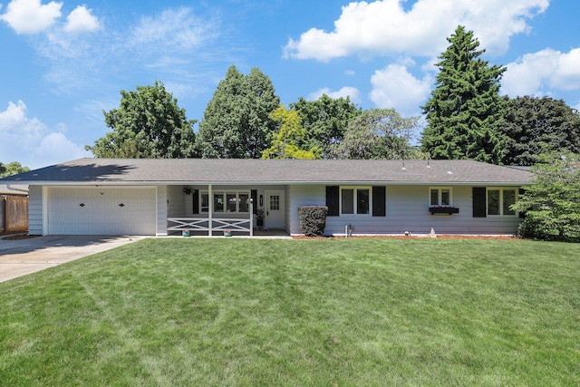 1919 E 59th Ave, Spokane, WA 99223 - ranch-style home with a garage, a front yard, and concrete driveway