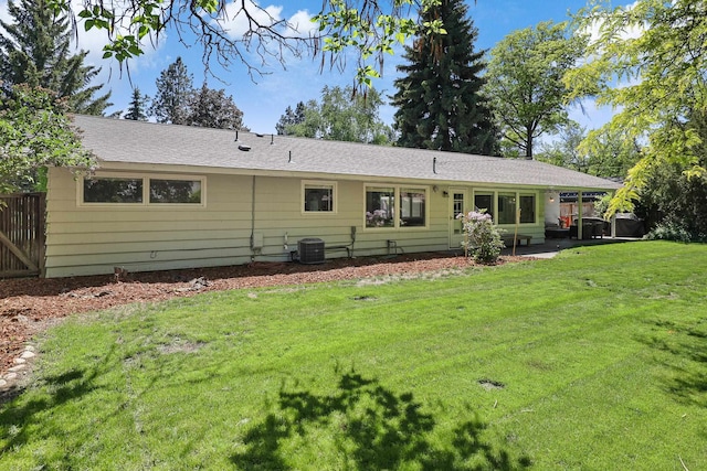1919 E 59th Ave, Spokane, WA 99223 - rear view of property featuring a lawn, central AC, and a patio area