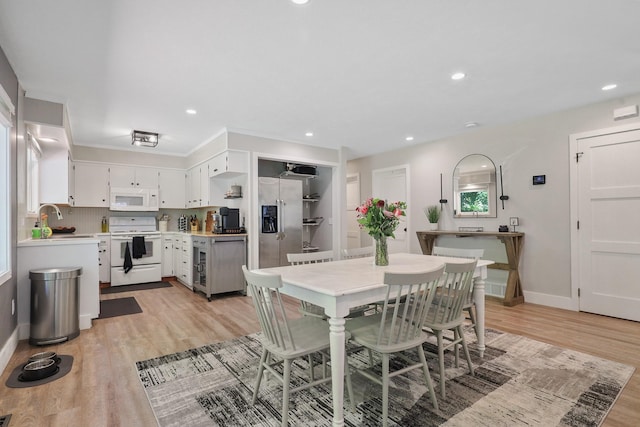 1919 E 59th Ave, Spokane, WA 99223 - dining space featuring light wood-style floors, baseboards, and recessed lighting