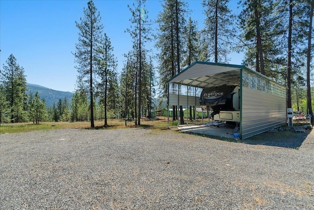 5 Crestview Rd, Kettle Falls, WA 99141 - view of parking with a carport, a mountain view, and gravel driveway
