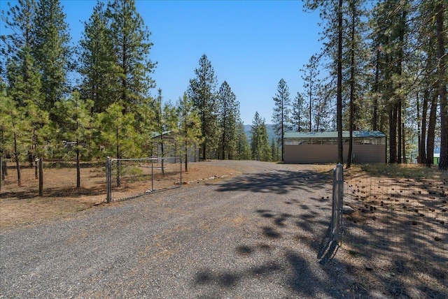 5 Crestview Rd, Kettle Falls, WA 99141 - view of asphalt driveway with a gate