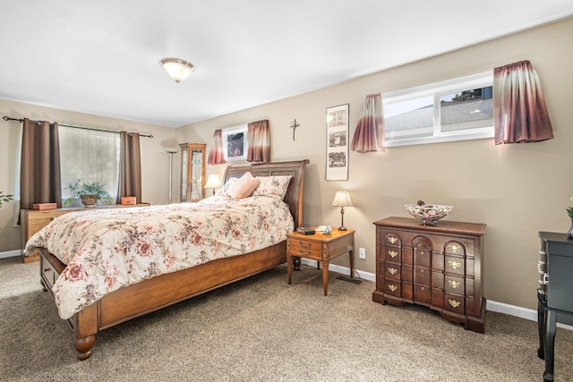 202 W Columbia Ave, Spokane, WA 99205 - bedroom with multiple windows, baseboards, and carpet floors