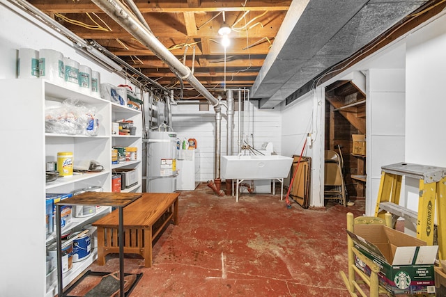 202 W Columbia Ave, Spokane, WA 99205 - unfinished basement with strapped water heater, a sink, and washer / dryer