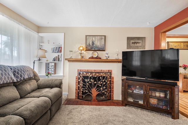 202 W Columbia Ave, Spokane, WA 99205 - living room featuring carpet and a brick fireplace