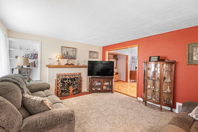 202 W Columbia Ave, Spokane, WA 99205 - carpeted living room with a fireplace, built in shelves, and baseboards