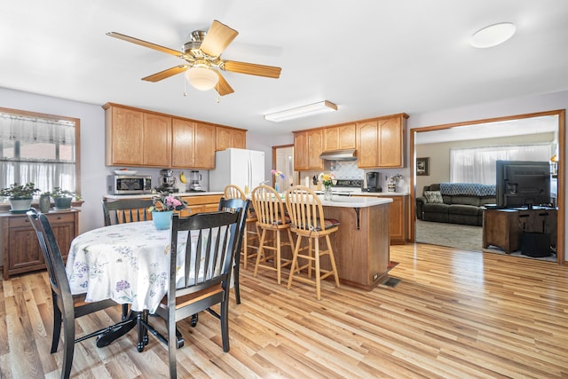 202 W Columbia Ave, Spokane, WA 99205 - dining area featuring light wood-style flooring and ceiling fan