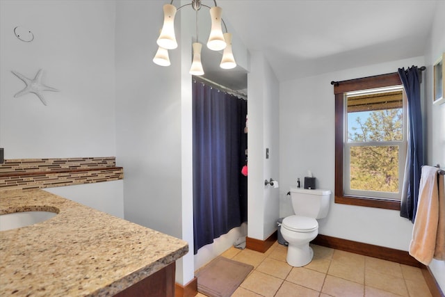 13625 S Sherman Rd, Spokane, WA 99224 - bathroom with vanity, toilet, backsplash, baseboards, and a shower with shower curtain