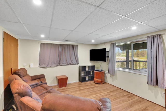 13625 S Sherman Rd, Spokane, WA 99224 - living room featuring a drop ceiling, wood finished floors, recessed lighting, and baseboards