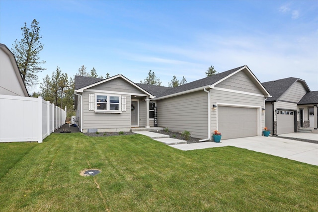 8620 W 8th Ave, Spokane, WA 99224 - view of front of home featuring an attached garage, concrete driveway, and a shingled roof