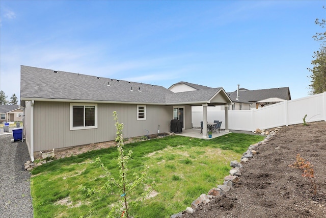 8620 W 8th Ave, Spokane, WA 99224 - back of property featuring a patio area and roof with shingles
