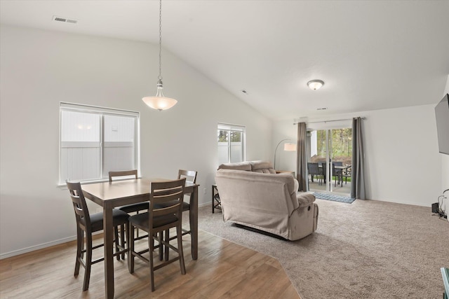 8620 W 8th Ave, Spokane, WA 99224 - dining space with lofted ceiling, light wood-style flooring, and baseboards