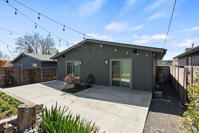 2518 W Bridge Ave, Spokane, WA 99201 - rear view of property featuring a patio area, a fenced backyard, and central AC
