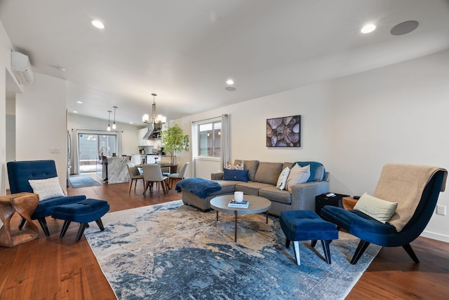 2518 W Bridge Ave, Spokane, WA 99201 - living area with dark wood-style floors, healthy amount of natural light, a chandelier, a wall mounted air conditioner, and recessed lighting