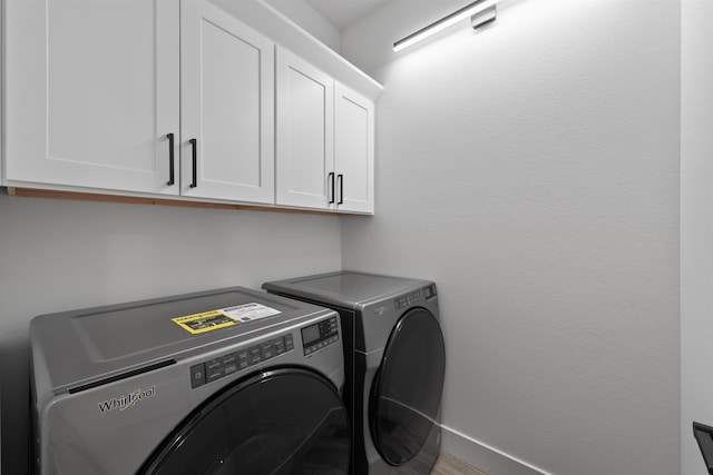 3617 E 1st Ave, Spokane, WA 99202 - laundry room featuring cabinet space and washing machine and dryer