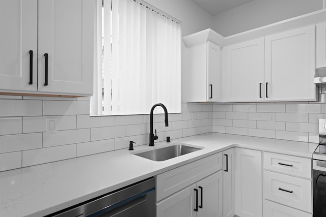 3617 E 1st Ave, Spokane, WA 99202 - kitchen featuring white cabinets, light countertops, decorative backsplash, and dishwasher