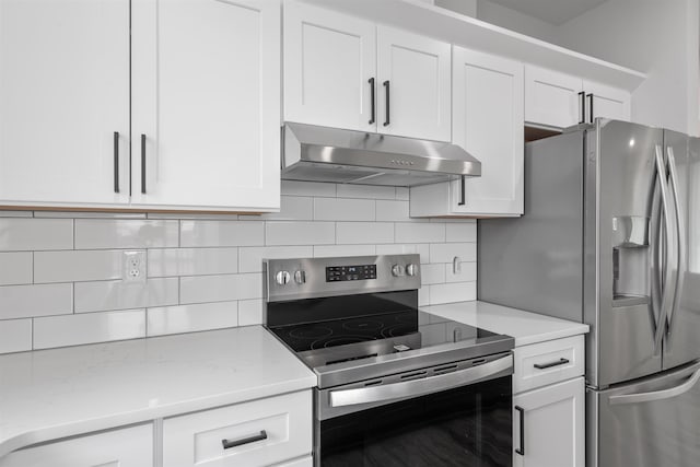 3617 E 1st Ave, Spokane, WA 99202 - kitchen featuring stainless steel appliances, extractor fan, white cabinets, and decorative backsplash