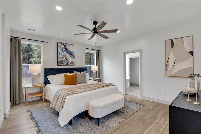 1399 W Findley Ln, Deer Park, WA 99006 - bedroom featuring multiple windows, light wood-style floors, baseboards, recessed lighting, and a ceiling fan