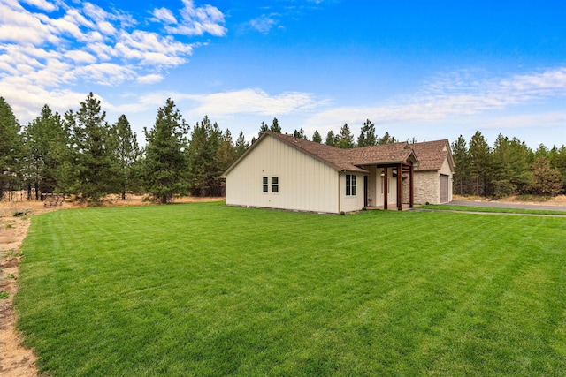 1399 W Findley Ln, Deer Park, WA 99006 - view of side of home featuring a yard and a garage