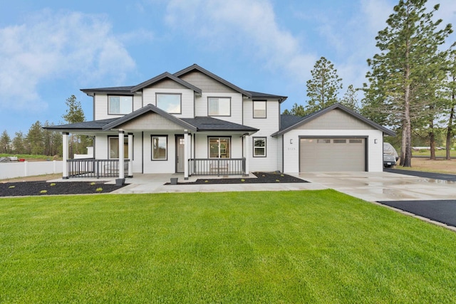 5125 N Ellie Ln, Spokane, WA 99217 - view of front of property featuring driveway, a garage, a porch, and a front lawn