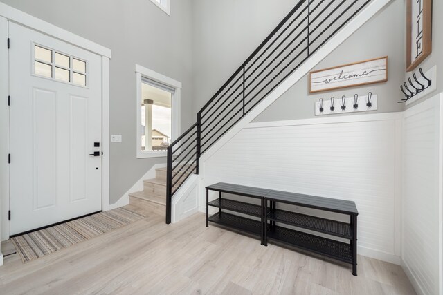 5125 N Ellie Ln, Spokane, WA 99217 - entrance foyer with light wood-style floors, healthy amount of natural light, stairway, a towering ceiling, and baseboards