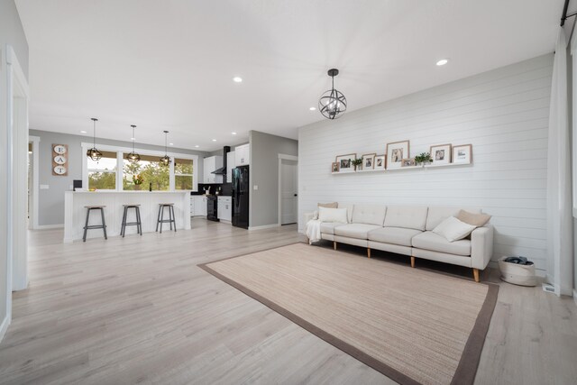 5125 N Ellie Ln, Spokane, WA 99217 - living room featuring recessed lighting, light wood-style floors, a chandelier, and baseboards
