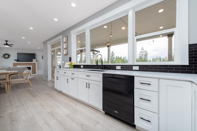 5125 N Ellie Ln, Spokane, WA 99217 - kitchen with black dishwasher, a sink, recessed lighting, decorative backsplash, and white cabinetry