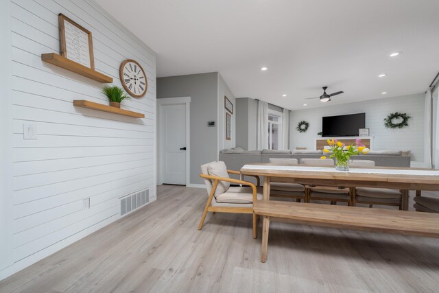 5125 N Ellie Ln, Spokane, WA 99217 - dining room with light wood finished floors, a ceiling fan, recessed lighting, baseboards, and wooden walls