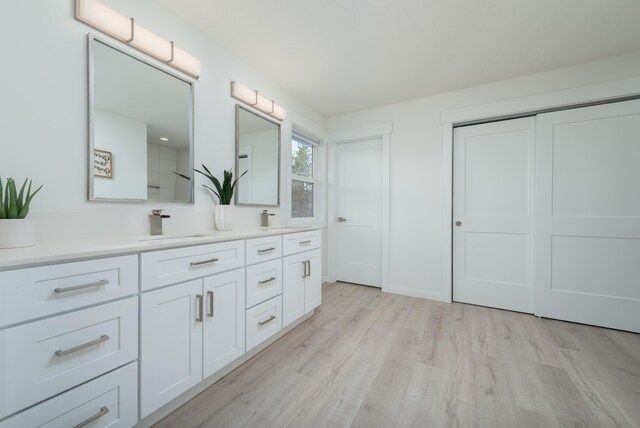 5125 N Ellie Ln, Spokane, WA 99217 - bathroom featuring double vanity and wood finished floors