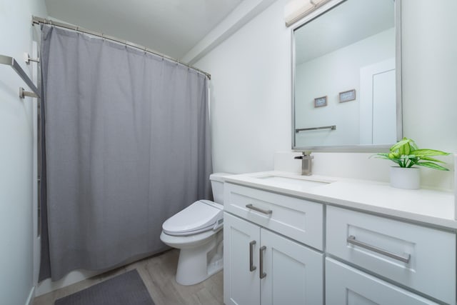 5125 N Ellie Ln, Spokane, WA 99217 - bathroom with vanity, toilet, and wood finished floors