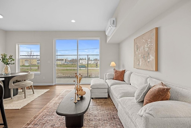 202 S Union Road Building B, Unit 102, Spokane, WA 99206 - living area featuring plenty of natural light, wood finished floors, recessed lighting, a wall unit AC, and baseboards
