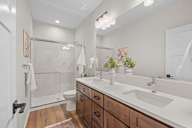 202 S Union Road Building B, Unit 102, Spokane, WA 99206 - full bath with toilet, double vanity, wood finished floors, and a marble finish shower