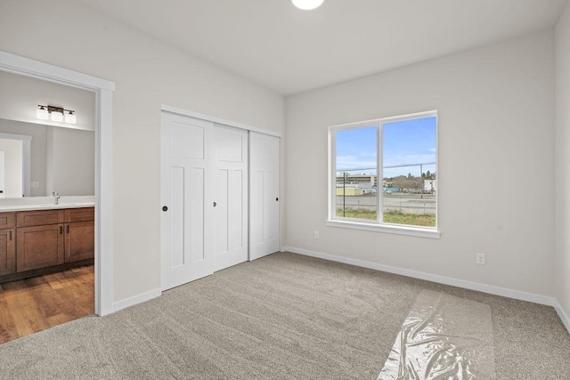 202 S Union Road Building B, Unit 102, Spokane, WA 99206 - unfurnished bedroom with carpet flooring, baseboards, and ensuite bathroom