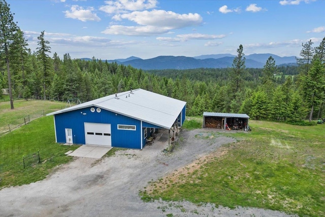 2559F United Copper Mine Rd, Chewelah, WA 99109 - view of pole building featuring a view of trees, a mountain view, and driveway