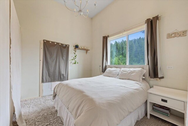 2559F United Copper Mine Rd, Chewelah, WA 99109 - bedroom with a chandelier and carpet floors