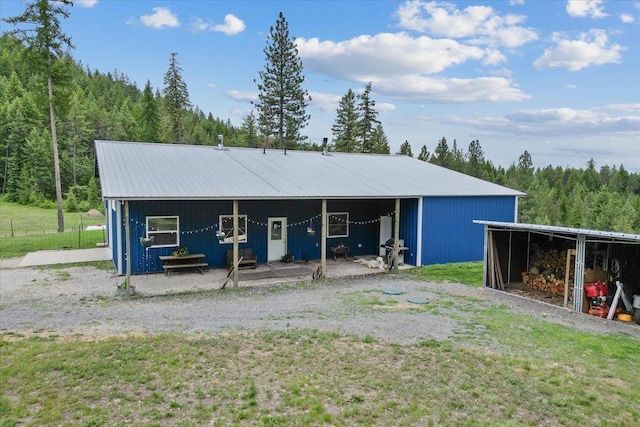 2559F United Copper Mine Rd, Chewelah, WA 99109 - view of outdoor structure featuring a forest view