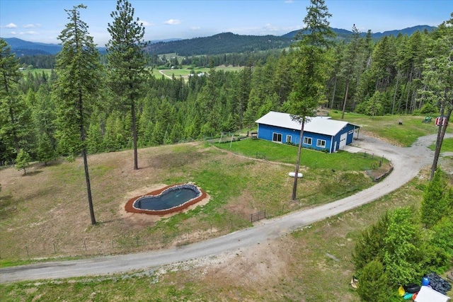 2559F United Copper Mine Rd, Chewelah, WA 99109 - aerial view of property and surrounding area with a forest and a mountain backdrop