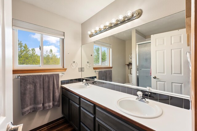 39810 N Hardesty Ln, Elk, WA 99009 - full bath with double vanity, toilet, and a stall shower