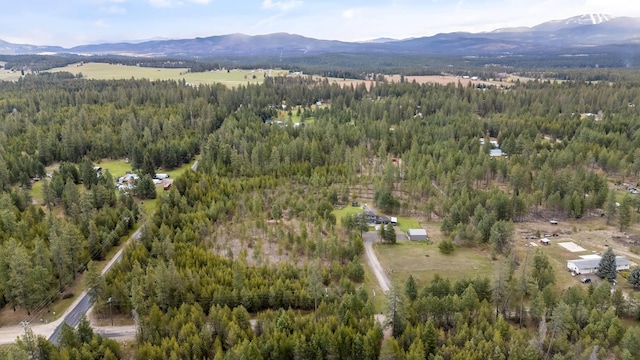 39810 N Hardesty Ln, Elk, WA 99009 - aerial overview of property's location featuring a heavily wooded area and a mountainous background