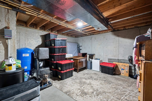 39810 N Hardesty Ln, Elk, WA 99009 - unfinished basement featuring fridge and a water pressure tank