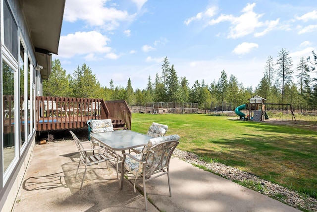 39810 N Hardesty Ln, Elk, WA 99009 - view of patio / terrace featuring a playground, outdoor dining area, a deck, and a trampoline