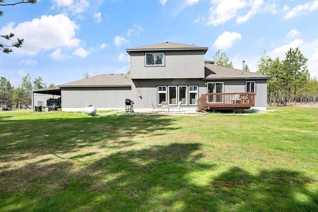 39810 N Hardesty Ln, Elk, WA 99009 - rear view of house with a deck, a lawn, a shingled roof, and a carport