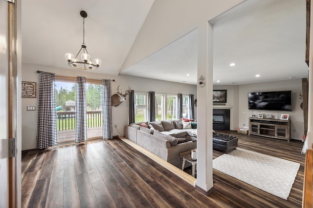 39810 N Hardesty Ln, Elk, WA 99009 - living area featuring dark wood-style flooring, a chandelier, a glass covered fireplace, recessed lighting, and lofted ceiling