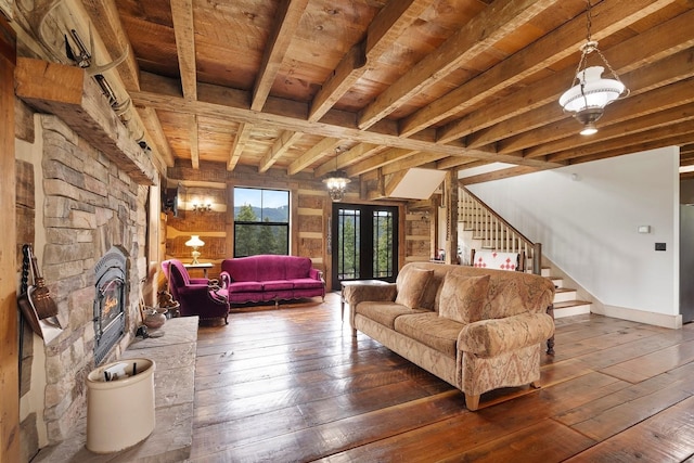 4165 S Varnum Pr, Coeur D Alene, ID 83814 - living area with wood ceiling with exposed beams, hardwood / wood-style flooring, stairs, and a stone fireplace