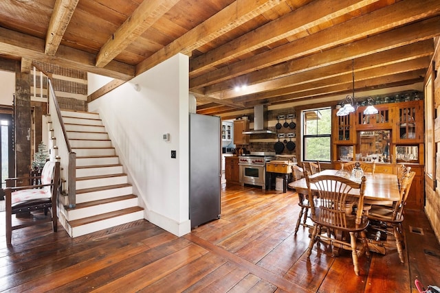 4165 S Varnum Pr, Coeur D Alene, ID 83814 - dining room featuring wood-type flooring, stairs, baseboards, and wood ceiling with exposed beams