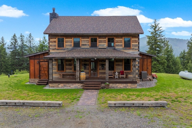 4165 S Varnum Pr, Coeur D Alene, ID 83814 - view of front facade featuring roof with shingles, cooling unit, a porch, a front lawn, and a chimney