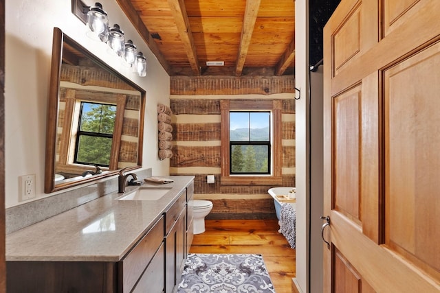 4165 S Varnum Pr, Coeur D Alene, ID 83814 - full bath with wood ceiling with exposed beams, a tub, vanity, wood finished floors, and toilet